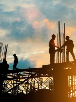 Silhouette of engineer and construction team working at site over blurred background sunset pastel for industry background with Light fair.Create from multiple reference images together.